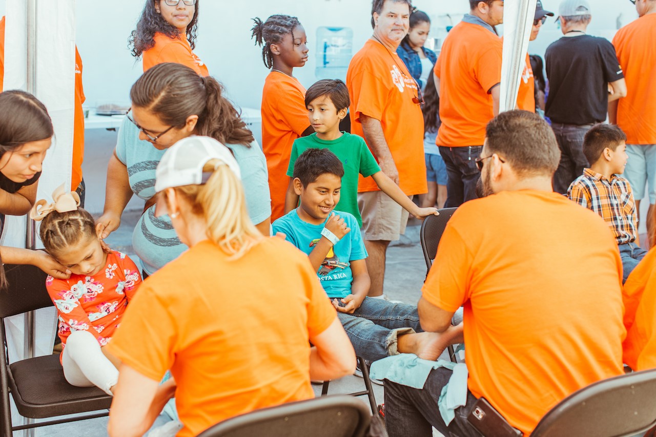 In Tijuana, Movement's own deliver shoes, seeds of hope