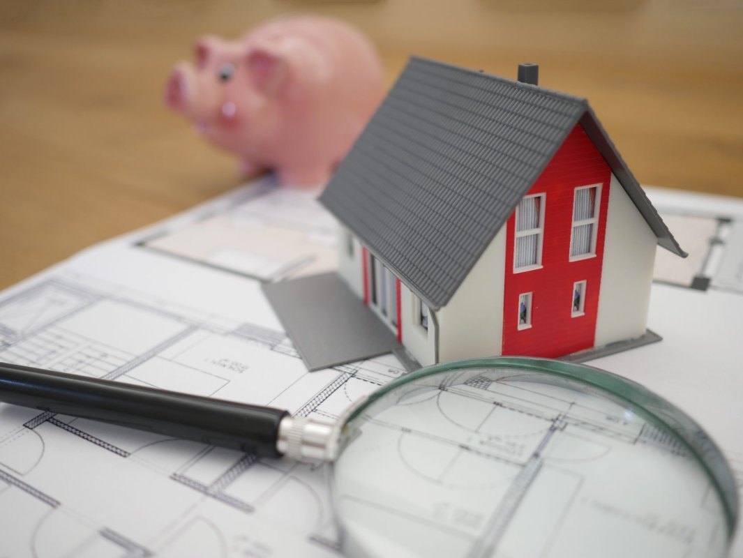 A toy house and magnifying glass
