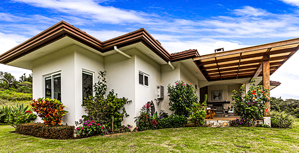 stucco home with spanish tile roof